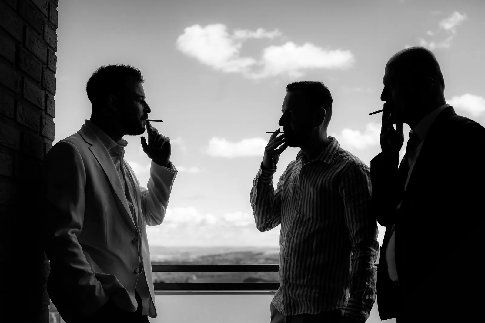 Botezul lui Ivan — botez ivan fabrica events cluj trei barbati siluete balcon bw atipic — fotograf botez